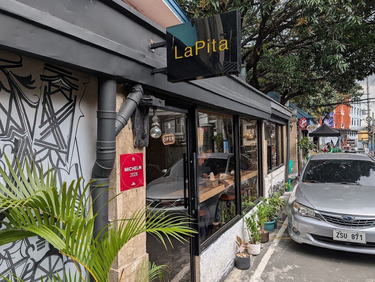 LaPita restaurant exterior on Don Pedro Street with Michelin 2026 plaque visible