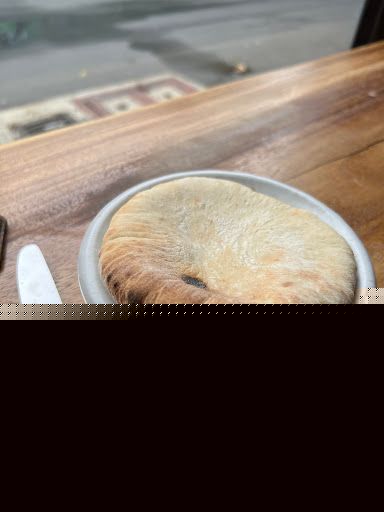 Freshly baked pita bread on a ceramic plate